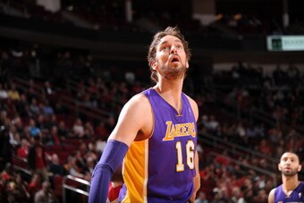 HOUSTON, TX - JANUARY 8:  Pau Gasol #16 of the Los Angeles Lakers reacts to a play against the Houston Rockets on January 8, 2014 at the Toyota Center in Houston, Texas. NOTE TO USER: User expressly acknowledges and agrees that, by downloading and or usin