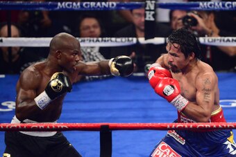 Jun. 9, 2012; Las Vegas, NV, USA; Timothy Bradley Jr (left) against Manny Pacquiao during a welterweight championship bout at the MGM Grand Garden Arena. Mandatory Credit: Mark J. Rebilas-USA TODAY Sports