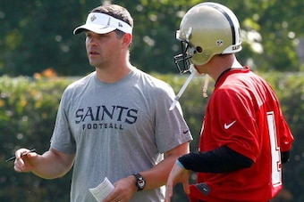 METAIRIE, LA - MAY 24: Quarterbacks coach Joe Lombardi of the New Orleans Saints works with Sean Canfield #4 during OTA's at the Saints Practice Facility on May 24, 2012 in Metairie, Louisiana.  (Photo by Sean Gardner/Getty Images)