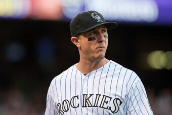 DENVER, CO - SEPTEMBER 22:  Troy Tulowitzki #2 of the Colorado Rockies looks on during a game against the Arizona Diamondbacks at Coors Field on September 22, 2013 in Denver, Colorado.  (Photo by Dustin Bradford/Getty Images)