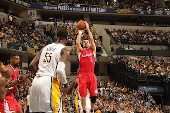 INDIANAPOLIS - JANUARY 18: J.J. Redick #4 of the Los Angeles Clippers shoots against the Indiana Pacers at Bankers Life Fieldhouse on January 18, 2014 in Indianapolis, Indiana.  NOTE TO USER: User expressly acknowledges and agrees that, by downloading and