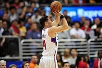January 15, 2014; Los Angeles, CA, USA; Los Angeles Clippers shooting guard J.J. Redick (4) shoots a three point basket against the Dallas Mavericks during the first half at Staples Center. Mandatory Credit: Gary A. Vasquez-USA TODAY Sports