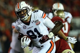PASADENA, CA - JANUARY 06:  Tight end C.J. Uzomah #81 of the Auburn Tigers is tackled after a catch against the Florida State Seminoles during the 2014 Vizio BCS National Championship Game at the Rose Bowl on January 6, 2014 in Pasadena, California.  (Pho
