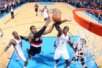 OKLAHOMA CITY, OK - JANUARY 21:  LaMarcus Aldridge #12 of the Portland Trail Blazers taking a shot during a game against the Oklahoma City Thunder on January 21, 2014 at the Chesapeake Energy Arena in Oklahoma City, Oklahoma. NOTE TO USER: User expressly 