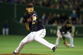 TOKYO, JAPAN - MARCH 08: Pitcher Masahiro Tanaka #17 of Japan pitches during the World Baseball Classic Second Round Pool 1 game between Japan and Chinese Taipei at Tokyo Dome on March 8, 2013 in Tokyo, Japan.  (Photo by Koji Watanabe/Getty Images)