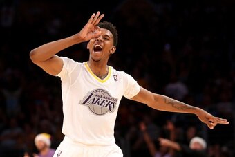 LOS ANGELES, CA - DECEMBER 25:  Nick Young #0 of the Los Angeles Lakers celebrates after making a three point basket against the Miami Heat at Staples Center on December 25, 2013 in Los Angeles, California. The Heat won 101-95.  NOTE TO USER: User express