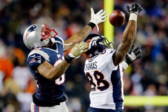 FOXBORO, MA - NOVEMBER 24: Wide receiver Demaryius Thomas #88 of the Denver Broncos tries to make a catch as cornerback Aqib Talib #31 of the New England Patriots defends during a game at Gillette Stadium on November 24, 2013 in Foxboro, Massachusetts.  (