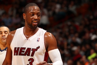 MIAMI, FL - JANUARY 7: Dwyane Wade #3 of the Miami Heat looks on against the New Orleans Pelicans at the American Airlines Arena in Miami, Florida on Jan. 7, 2014. NOTE TO USER: User expressly acknowledges and agrees that, by downloading and/or using this MIAMI, FL - JANUARY 7: Dwyane Wade #3 of the Miami Heat looks on against the New Orleans Pelicans at the American Airlines Arena in Miami, Florida on Jan. 7, 2014. NOTE TO USER: User expressly acknowledges and agrees that, by downloading and/or using this
