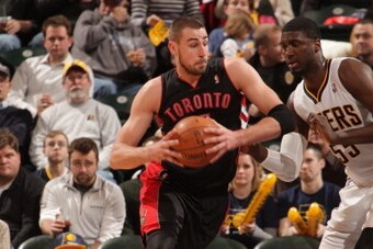 INDIANAPOLIS - JANUARY 7: Jonas Valanciunas #17 of the Toronto Raptors drives against the Indiana Pacers at Bankers Life Fieldhouse on January 7, 2014 in Indianapolis, Indiana.  NOTE TO USER: User expressly acknowledges and agrees that, by downloading and