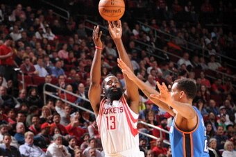 HOUSTON, TX - JANUARY 16:  James Harden #13 of the Houston Rockets shoots against the Oklahoma City Thunder on January 16, 2014 at the Toyota Center in Houston, Texas. NOTE TO USER: User expressly acknowledges and agrees that, by downloading and or using 