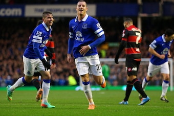 LIVERPOOL, ENGLAND - JANUARY 04:  Ross Barkley of Everton celebrates scoring the first goal with Bryan Oviedo of Everton during the Budweiser FA Cup Third Round match between Everton and Queens Park Rangers at Goodison Park on January 4, 2014 in Liverpool