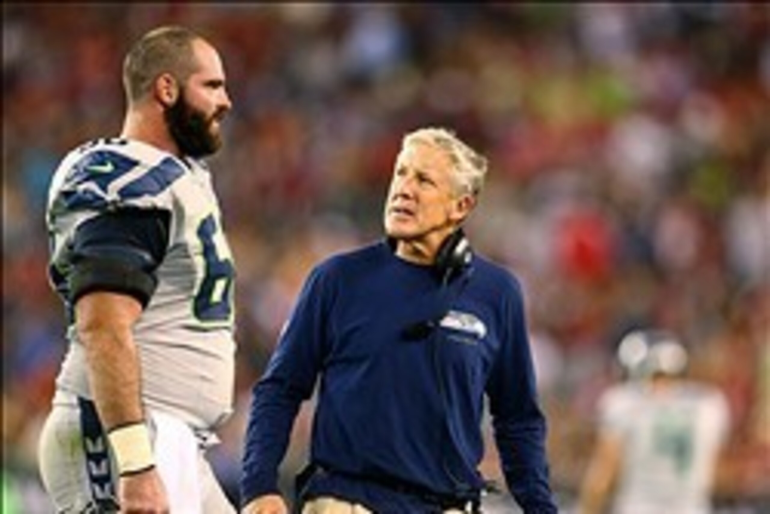 Oct 17, 2013; Phoenix, AZ, USA; Seattle Seahawks head coach Pete Carroll (right) talks to center Max Unger against the Arizona Cardinals at University of Phoenix Stadium. Mandatory Credit: Mark J. Rebilas-USA TODAY Sports
