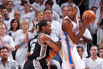 OKLAHOMA CITY, OK - JUNE 6: Kevin Durant #35 of the Oklahoma City Thunder posts up against Kawhi Leonard #2 of the San Antonio Spurs in Game Six of the Western Conference Finals during the 2012 NBA Playoffs on June 6, 2012 at the Chesapeake Energy Arena i