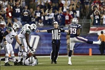 Sep 12, 2013; Foxborough, MA, USA; New England Patriots defensive end Michael Buchanan (99) celebrates after sacking New York Jets quarterback Geno Smith (left on ground) during the first half at Gillette Stadium. Mandatory Credit: Mark L. Baer-USA TODAY 
