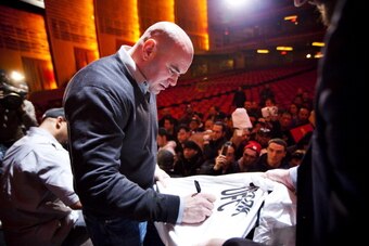 NEW YORK - MARCH 06:   UFC president Dana White signs autographs for fans after a press conference at Radio City Music Hall on March 06, 2012 in New York City.  UFC announced that their third event on the FOX network will take place on Saturday, May 5 fro