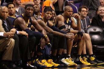 PHOENIX, AZ - JANUARY 22:  (R-L) David West #21, Lance Stephenson #1, Paul George #24 and Roy Hibbert #55 of the Indiana Pacers react on the bench during the second half of the NBA game against the Phoenix Suns at US Airways Center on January 22, 2014 in 