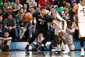 SALT LAKE CITY, UT - JANUARY 21:  Kevin Love #42 of the Minnesota Timberwolves drives against Marvin Williams #2 of the Utah Jazz at EnergySolutions Arena on January 21, 2014 in Salt Lake City, Utah. NOTE TO USER: User expressly acknowledges and agrees th