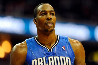 Feb 29, 2012; Washington, DC, USA; Orlando Magic center Dwight Howard (12) reacts against the Washington Wizards during the first half at the Verizon Center. Mandatory Credit: Brad Mills-USA TODAY Sports