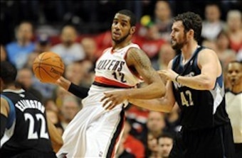 April 1, 2012; Portland, OR, USA; Portland Trail Blazers power forward LaMarcus Aldridge (12) battles for position with Minnesota Timberwolves power forward Kevin Love (42) during the fourth quarter of the game at the Rose Garden. The Blazers won the game