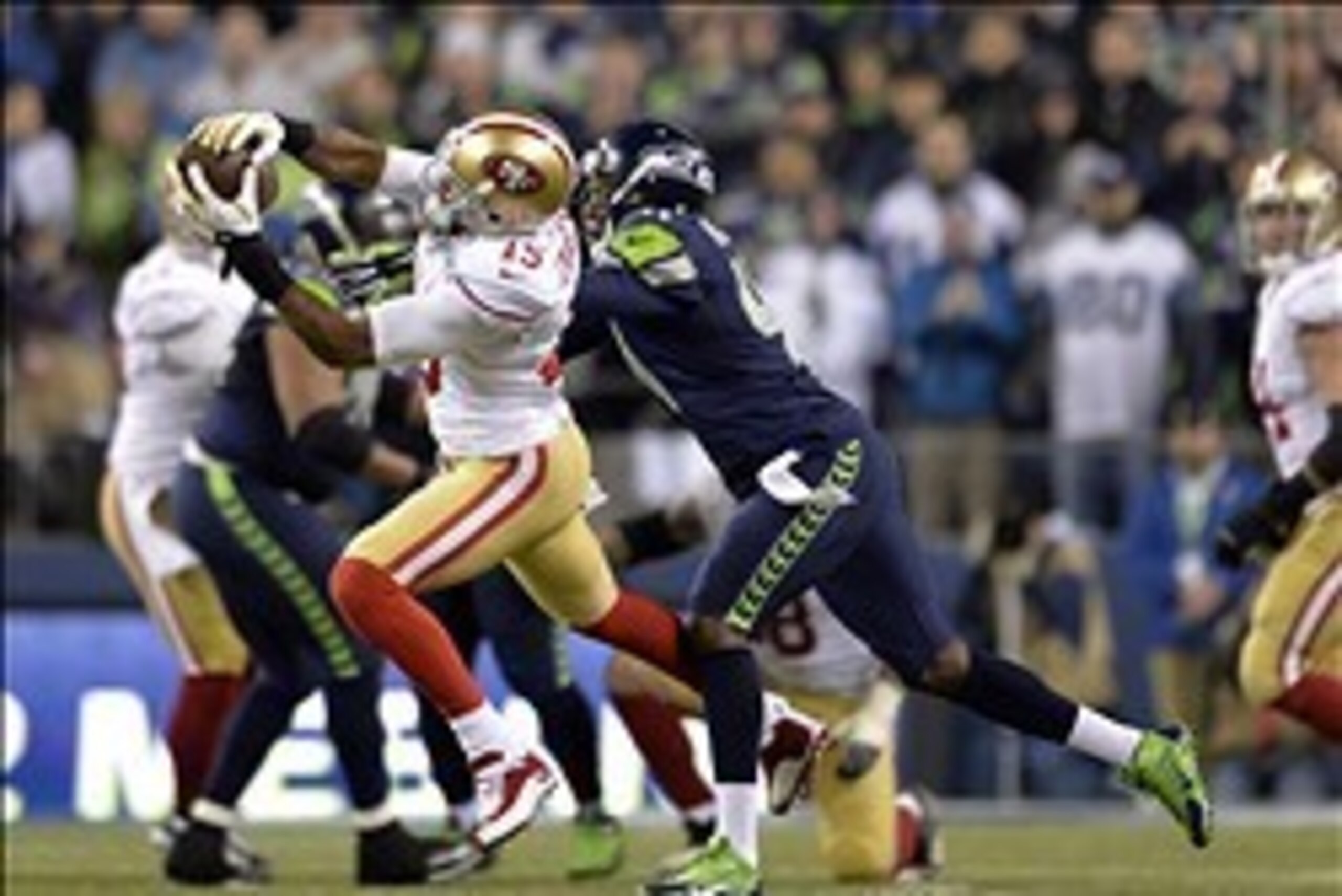 Jan 19, 2014; Seattle, WA, USA; San Francisco 49ers wide receiver Michael Crabtree (15) catches a pass against Seattle Seahawks cornerback Byron Maxwell (41)  during the second half of the 2013 NFC Championship football game at CenturyLink Field. Mandator