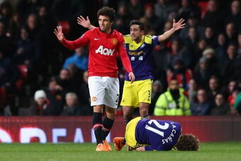 MANCHESTER, ENGLAND - JANUARY 05:  Fabio of Manchester United reacts following his red-card challenge on Jose Canas of Swansea City during the FA Cup with Budweiser Third round match between Manchester United and Swansea City at Old Trafford on January 5,