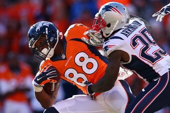 DENVER, CO - JANUARY 19:  Demaryius Thomas #88 of the Denver Broncos in action against  LeGarrette Blount #29 of the New England Patriots during the AFC Championship game at Sports Authority Field at Mile High on January 19, 2014 in Denver, Colorado.  (Ph