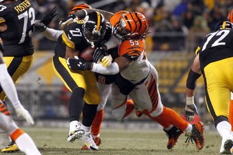 PITTSBURGH, PA - DECEMBER 15:  Vontaze Burfict #55 of the Cincinnati Bengals tackles Jonathan Dwyer #27 of the Pittsburgh Steelers during the game on December 15, 2013 at Heinz Field in Pittsburgh, Pennsylvania.  (Photo by Justin K. Aller/Getty Images)