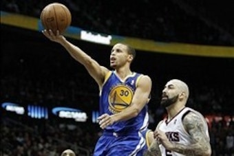 Jan 3, 2014; Atlanta, GA, USA; Golden State Warriors point guard Stephen Curry (30) shoots the ball against the Atlanta Hawks in the second quarter at Philips Arena. Mandatory Credit: Brett Davis-USA TODAY Sports