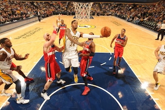 INDIANAPOLIS - JANUARY 10: Paul George #24 of the Indiana Pacers shoots against the Washington Wizards at Bankers Life Fieldhouse on January 10, 2014 in Indianapolis, Indiana.  NOTE TO USER: User expressly acknowledges and agrees that, by downloading and 