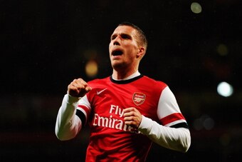 LONDON, ENGLAND - JANUARY 24:  Lukas Podolski of Arsenal celebrates as he scores their second goal with a header during the FA Cup with Budweiser Fourth round match between Arsenal and Coventry City at Emirates Stadium on January 24, 2014 in London, Engla