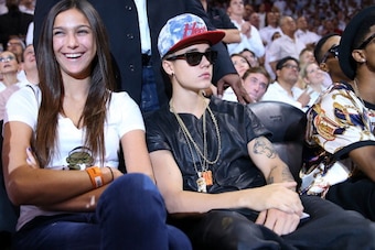 MIAMI, FL - JUNE 03:  Singer Justin Bieber sits courtside as he watches the Miami Heat host the Indiana Pacers during Game Seven of the Eastern Conference Finals of the 2013 NBA Playoffs at AmericanAirlines Arena on June 3, 2013 in Miami, Florida.  NOTE T