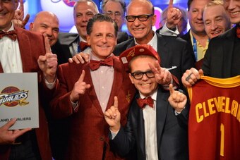 NEW YORK, NY - MAY 21:  Owner Dan Gilbert and Nick Gilbert of the Cleveland Cavaliers poses for a photo after winning the overall number one pick during the 2013 NBA Draft Lottery on May 21, 2013 at the ABC News' 'Good Morning America' Times Square Studio