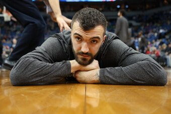 MINNEAPOLIS, MN - DECEMBER 27:  Nikola Pekovic #14 of the Minnesota Timberwolves stretches before the game against the Washington Wizards on December 27, 2013 at Target Center in Minneapolis, Minnesota. NOTE TO USER: User expressly acknowledges and agrees