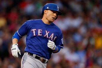 BOSTON, MA - JUNE 6:  Jeff Baker #15 of the Texas Rangers rounds the bases after hitting a home run against Jon Lester (not pictured) of the Boston Red Sox in the second inning at Fenway Park on June 6, 2013 in Boston, Massachusetts.  (Photo by Jim Rogash