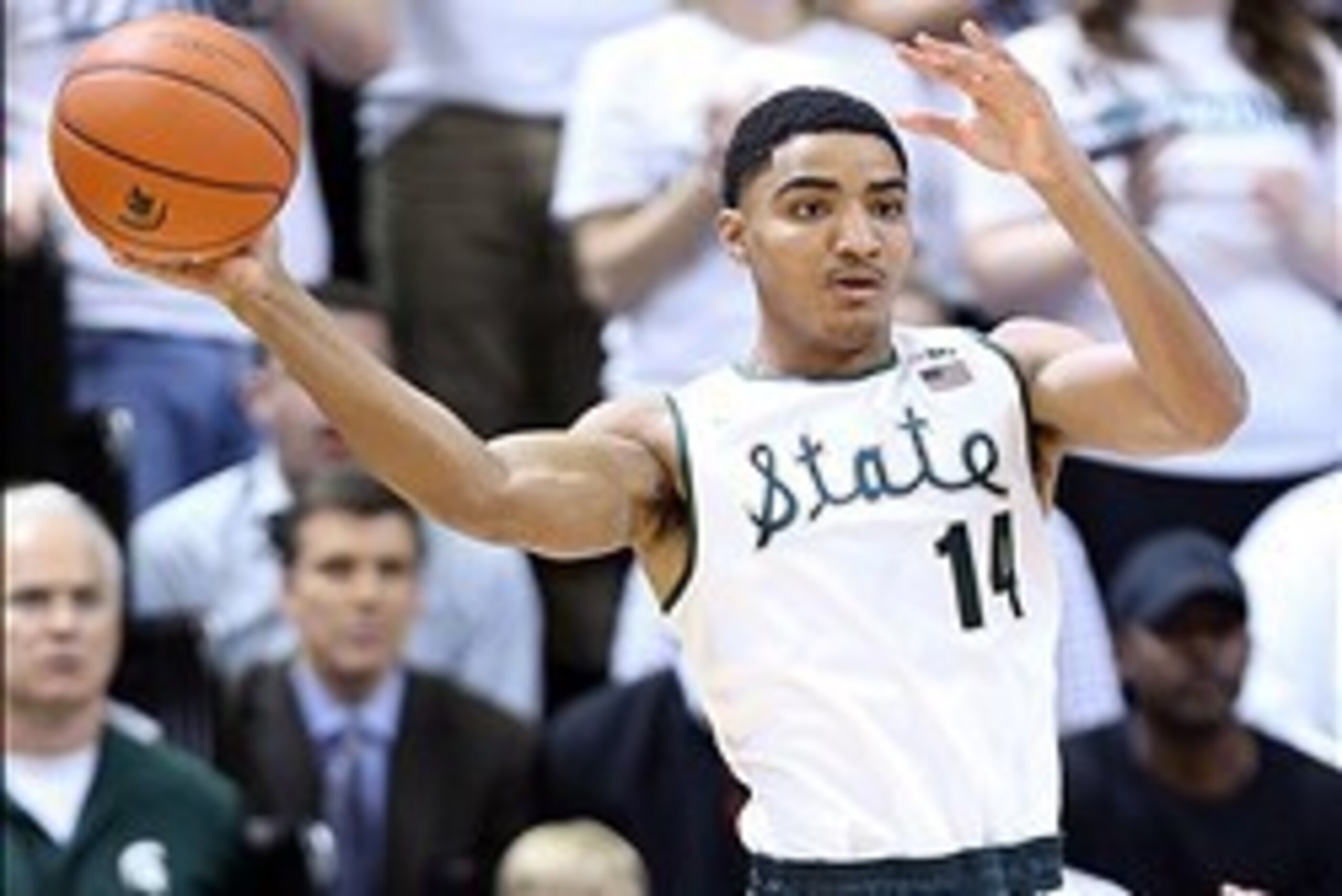 Jan 25, 2014; East Lansing, MI, USA; Michigan State Spartans guard Gary Harris (14) looks to pass the ball against Michigan Wolverines during the 1st half of a game at Jack Breslin Student Events Center. Mandatory Credit: Mike Carter-USA TODAY Sports