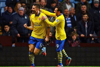BIRMINGHAM, ENGLAND - JANUARY 13:  Olivier Giroud of Arsenal (L) celebrates scoring their second goal with Santi Cazorla of Arsenal during the Barclays Premier League match between Aston Villa and Arsenal at Villa Park on January 13, 2014 in Birmingham, E