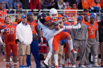 BOISE, ID - NOVEMBER 12: Matt Miller #2 of the Boise State Broncos fails to come up with the ball against Jason Verrett #2 of the TCU Horned Frogs at Bronco Stadium on November 12, 2011 in Boise, Idaho. Verrett was called for holding. (Photo by Otto Kits BOISE, ID - NOVEMBER 12: Matt Miller #2 of the Boise State Broncos fails to come up with the ball against Jason Verrett #2 of the TCU Horned Frogs at Bronco Stadium on November 12, 2011 in Boise, Idaho. Verrett was called for holding. (Photo by Otto Kits