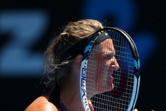 MELBOURNE, AUSTRALIA - JANUARY 22:  Victoria Azarenka of Belarus reacts to a point in her quarterfinal match against Agnieszka Radwanska of Poland during day 10 of the 2014 Australian Open at Melbourne Park on January 22, 2014 in Melbourne, Australia.  (P