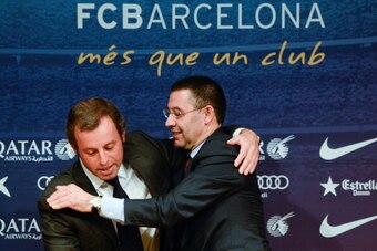 BARCELONA, SPAIN - JANUARY 23: FCB Vice-President Josep Maria Bartomeu hugs FCB President Sandro Rosell after the press conference announcing his resgination as FCB president on January 23, 2014 in Barcelona, Spain. FCB President Sandro Rosell is under in