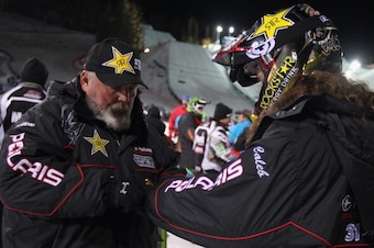 ASPEN, CO - JANUARY 23:  Wade Moore (L) helps apply the equipment to his son Colten Moore (R) during the snowmobile freestyle finals at Winter X-Games 2014 Aspen at Buttermilk Mountain on January 23, 2014 in Aspen, Colorado. Colten Moore went on to win th
