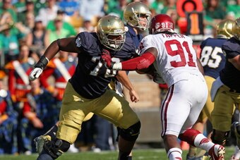 SOUTH BEND, IN - SEPTEMBER 28: Ronnie Stanley #78 of the Notre Dame Fighting Irish blocks Charles Tapper #91 of the Oklahoma Sooners at Notre Dame Stadium on September 28, 2013 in South Bend, Indiana. Oklahoma defeated Notre Dame 35-21. (Photo by Jonathan