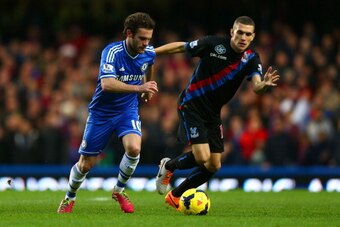 LONDON, ENGLAND - DECEMBER 14: Juan Mata of Chelsea is marked by Stuart O'Keefe of Crystal Palace during the Barclays Premier League match between Chelsea and Crystal Palace at Stamford Bridge on December 14, 2013 in London, England. (Photo by Paul Gilham