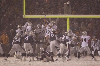 19 Jan 2002:  Adam Vinatieri #4 of the New England Patriots kicks the game-winning field goal against the Oakland Raiders during the AFC playoff game at Foxboro Stadium in Foxboro, Massachusetts. DIGITAL IMAGE. Mandatory Credit : Ezra Shaw/ Getty Images