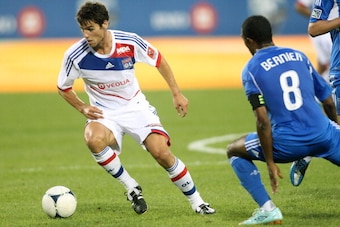 MONTREAL, CANADA - JULY 24:  Yoann Gourcuff #8 of Olympique Lyonnais stops the ball and turns in front of Patrice Bernier #8 of the Montreal Impact during the MLS match at the Saputo Stadium on July 24, 2012 in Montreal, Quebec, Canada.  The Olympique def