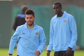 MANCHESTER, ENGLAND - SEPTEMBER 26: Sergio Aguero (L) and Yaya Toure of Manchester City attend a training session ahead of their UEFA Champions League Group A match against Bayern Munich on September 26, 2011 in Manchester, United Kingdom.  (Photo by Mich