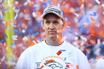 DENVER, CO - JANUARY 19:  Peyton Manning #18 of the Denver Broncos celebrates after they defeated the New England Patriots 26 to 16 during the AFC Championship game at Sports Authority Field at Mile High on January 19, 2014 in Denver, Colorado.  (Photo by