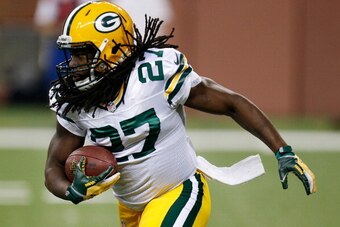 DETROIT, MI - NOVEMBER 28: Eddie Lacy #27 of the Green Bay Packers looks for an opening during a first quarter run while playing the Detroit Lions at Ford Field on November 28, 2013 in Detroit, Michigan. (Photo by Gregory Shamus/Getty Images)