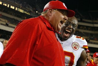 PHILADELPHIA, PA - SEPTEMBER 19: Head coach Andy Reid of the Kansas City Chiefs  reacts to getting a Gatorade shower with linebacker Justin Houston #50 after defeating the Philadelphia Eagles 26-16 during a game at Lincoln Financial Field on September 19,