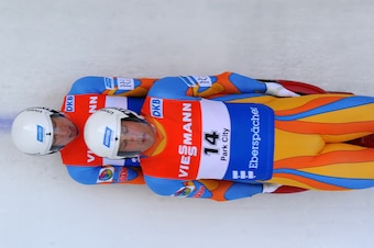 PARK CITY, UT - DECEMBER 13: Matthew Mortensen (top) and Preston Griffall of the United States are on track in the Doubles competition during the Viessmann Luge World Cup event at Utah Olympic Park December 13, 2013 in Park City, Utah. (Photo by Gene Swee