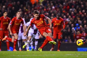 LIVERPOOL, ENGLAND - JANUARY 18:  Steven Gerrard of Liverpool scores his penalty during the Barclays Premier League match between Liverpool and Aston Villa at Anfield on January 18, 2014 in Liverpool, England.  (Photo by Michael Regan/Getty Images)
